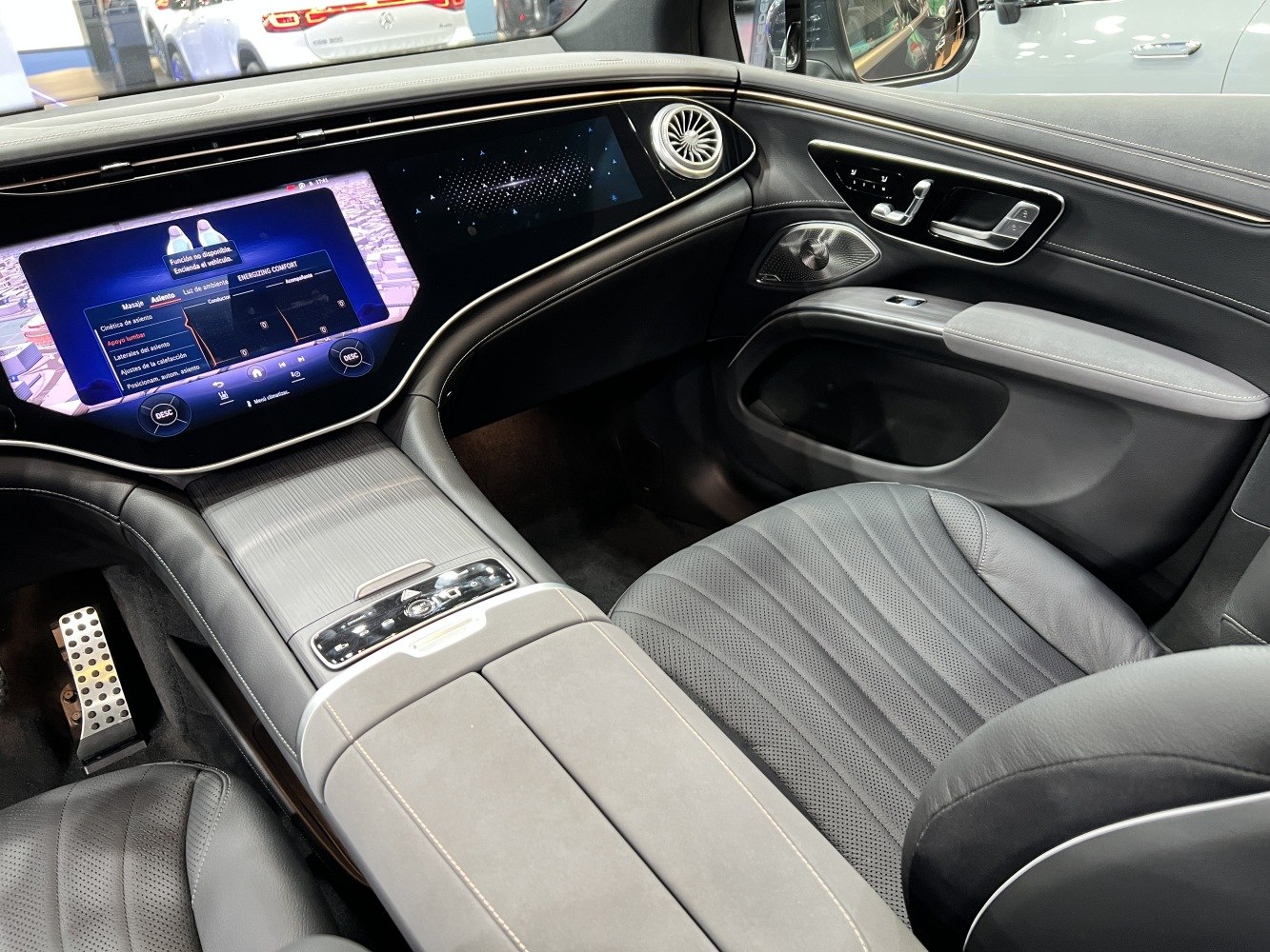 Wide touchscreen digital cockpit and luxury interior with ambient lighting