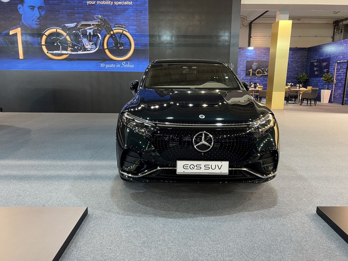 Front view of a sleek black electric luxury SUV with futuristic grille and LED headlights.