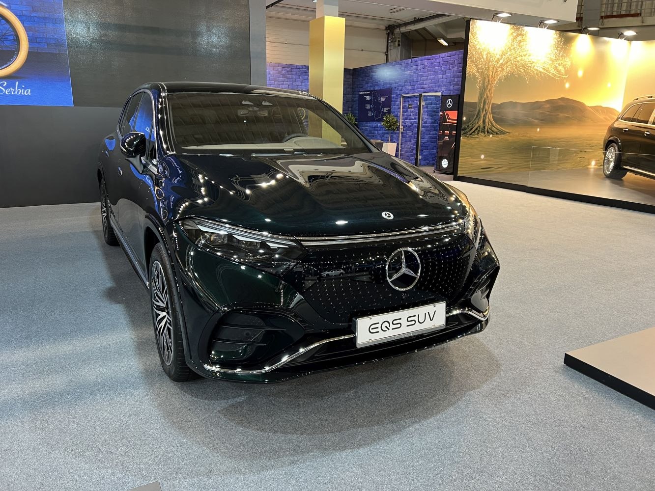 Front view with prominent grille and LED headlights.
