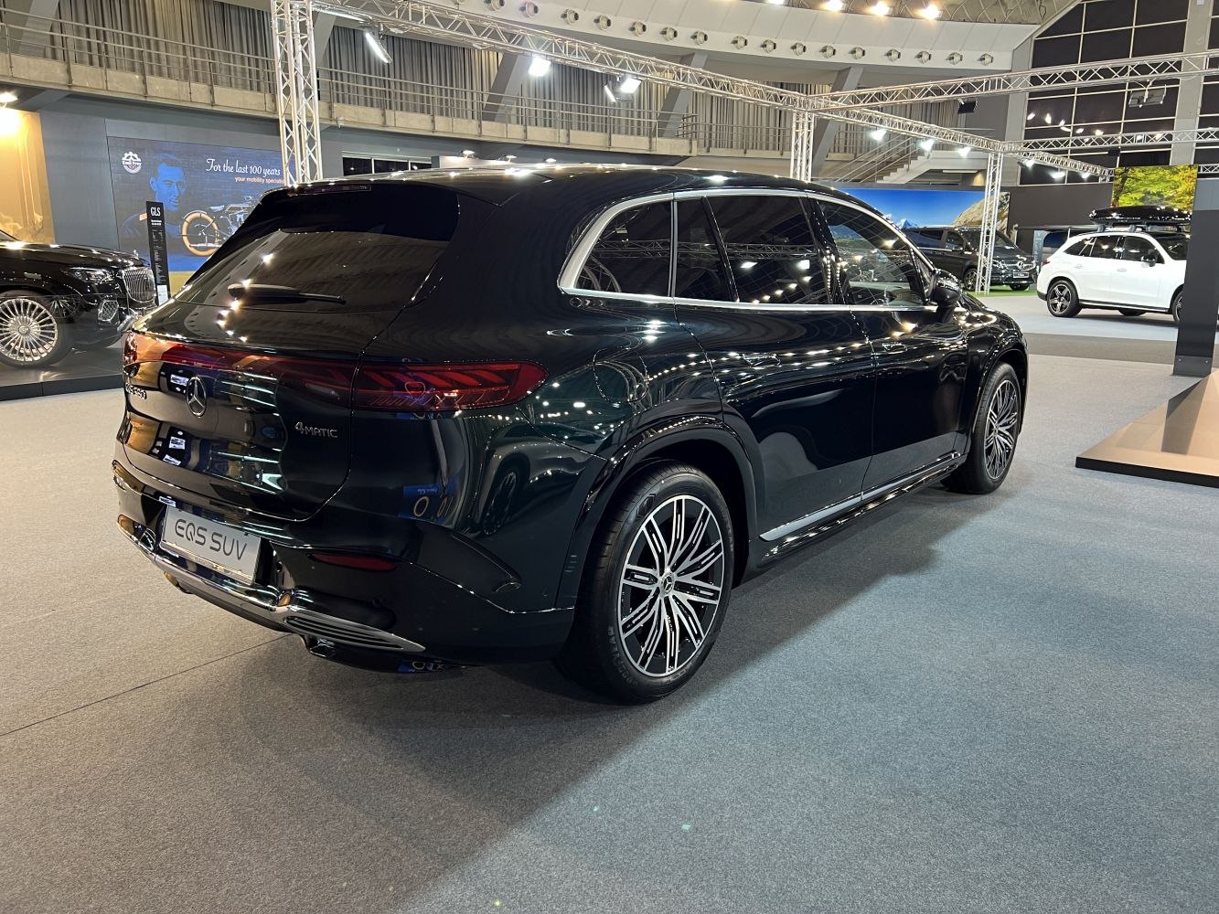 Rear side view of black luxury SUV with 4MATIC badge and distinct taillights
