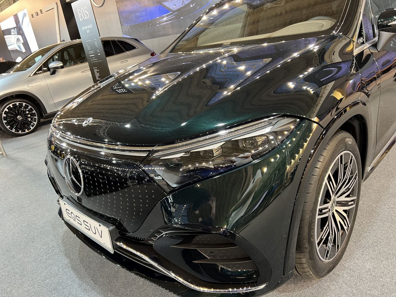 Close-up of front end, headlights and alloy wheel design