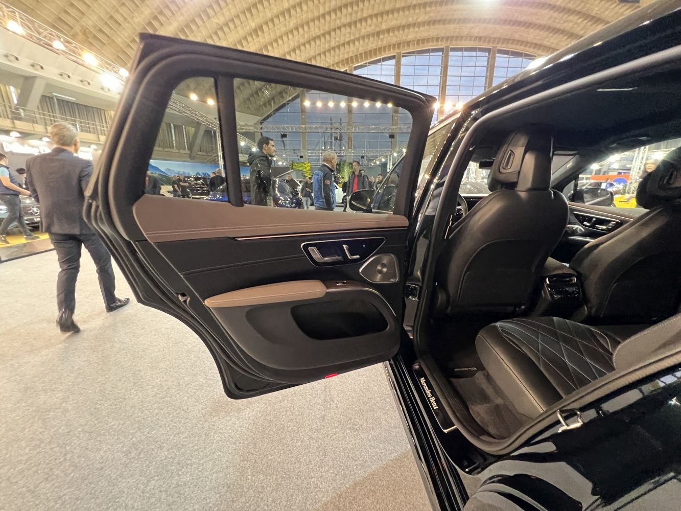 Luxury rear door panel and quilted leather rear seats in upscale vehicle interior