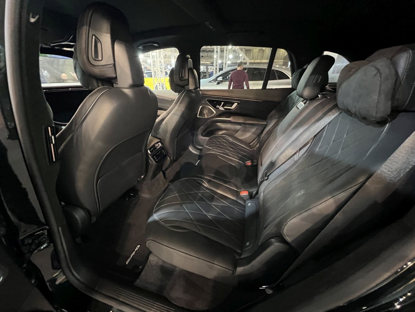 Rear black quilted leather seats in a luxury SUV interior