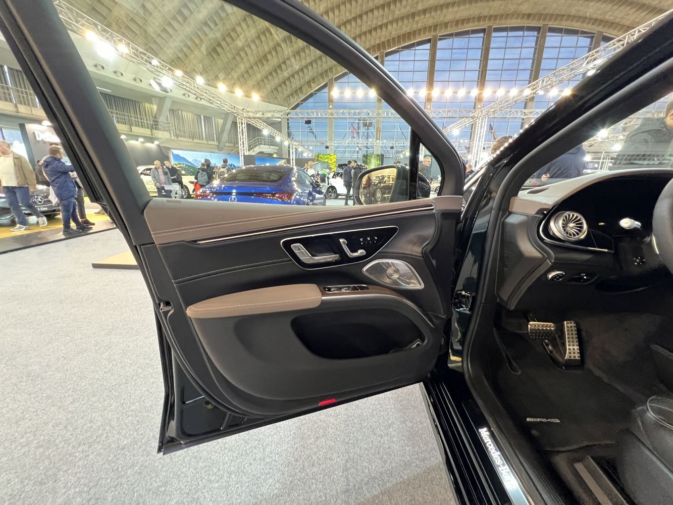Luxury interior door panel with leather trim and metal accents