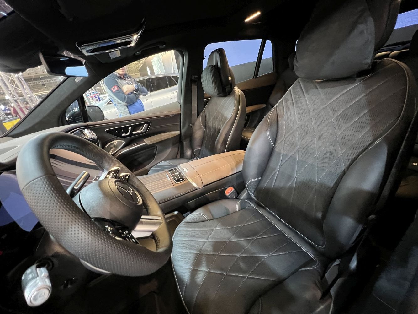 Premium leather seats and advanced steering wheel in modern SUV interior