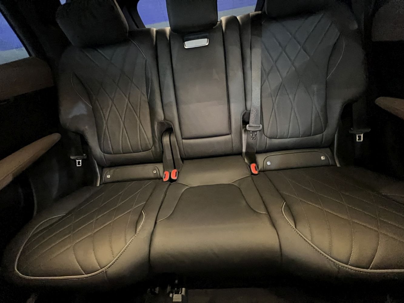 Quilted leather rear seating with luxury armrests and seat belt