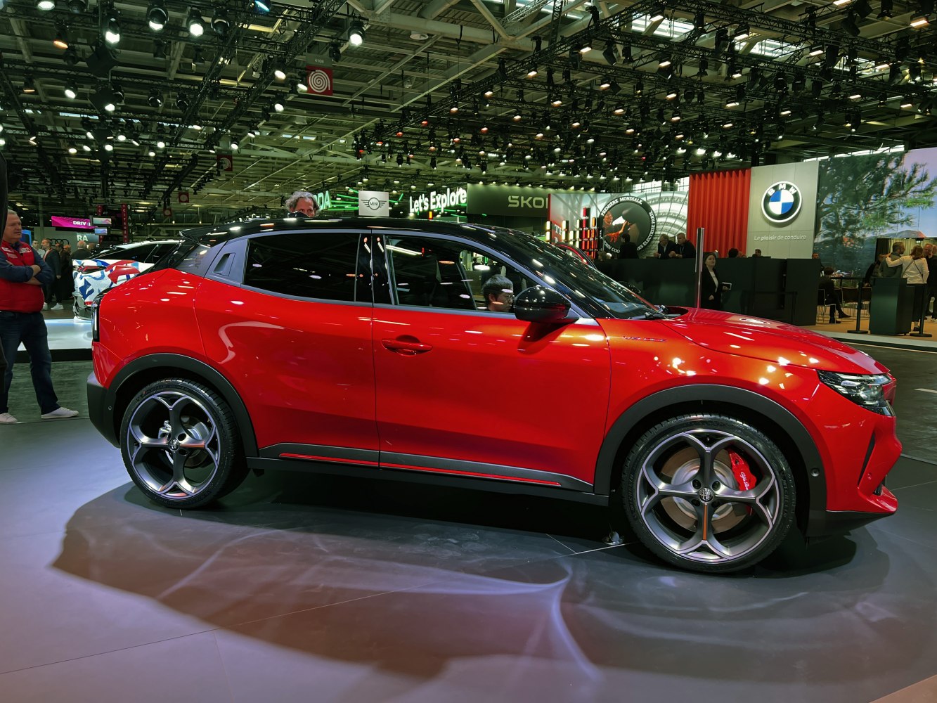 Red crossover with sporty alloy wheels and black roof