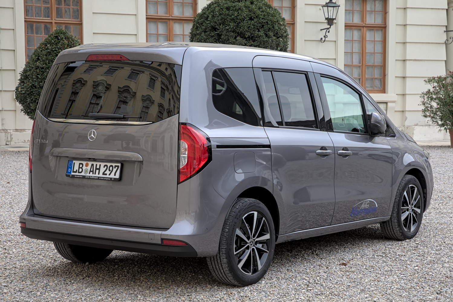 Rear view, tinted rear window, modern rear lights.