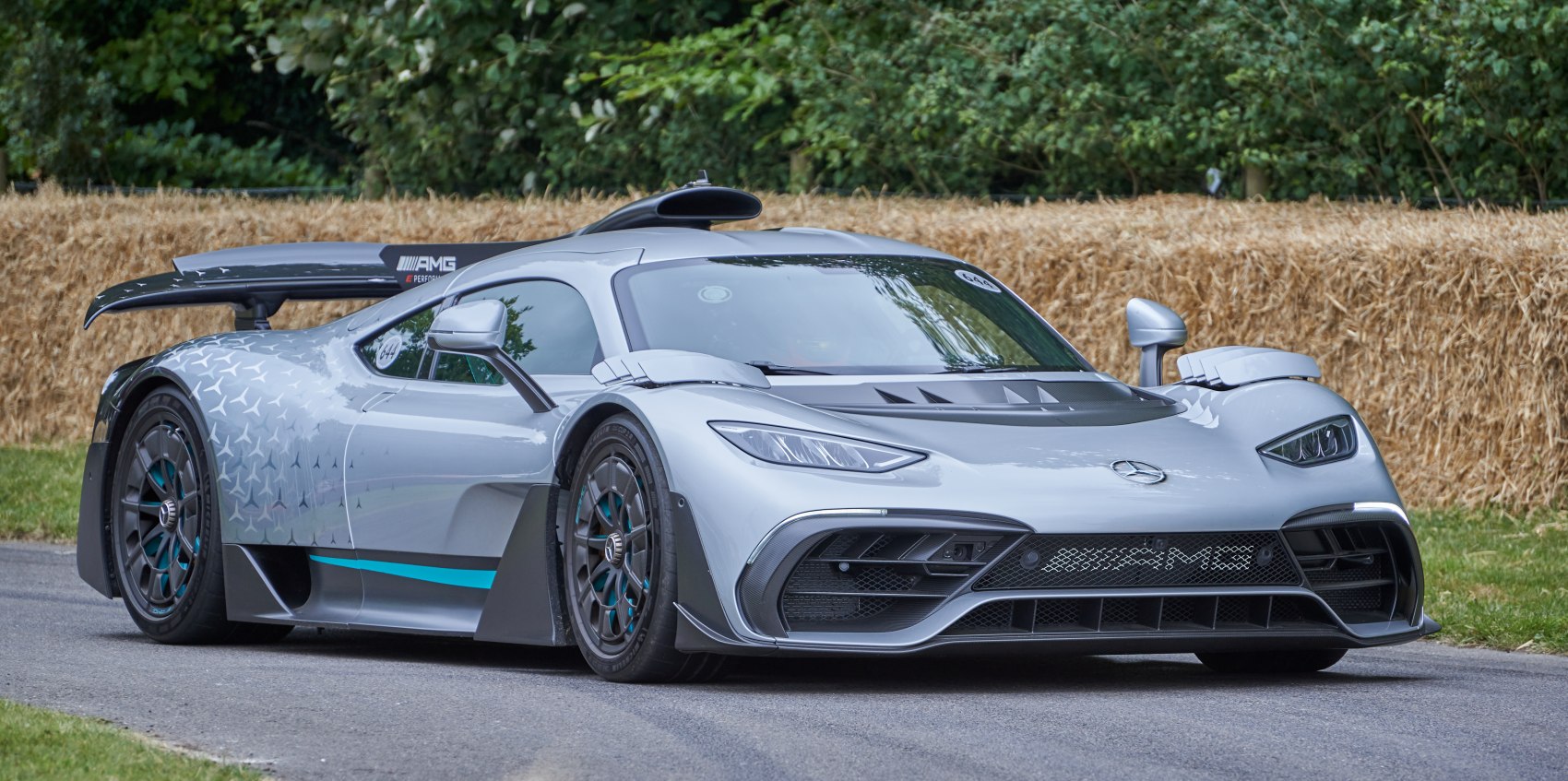 Aerodynamic hypercar with dynamic headlights and rear wing