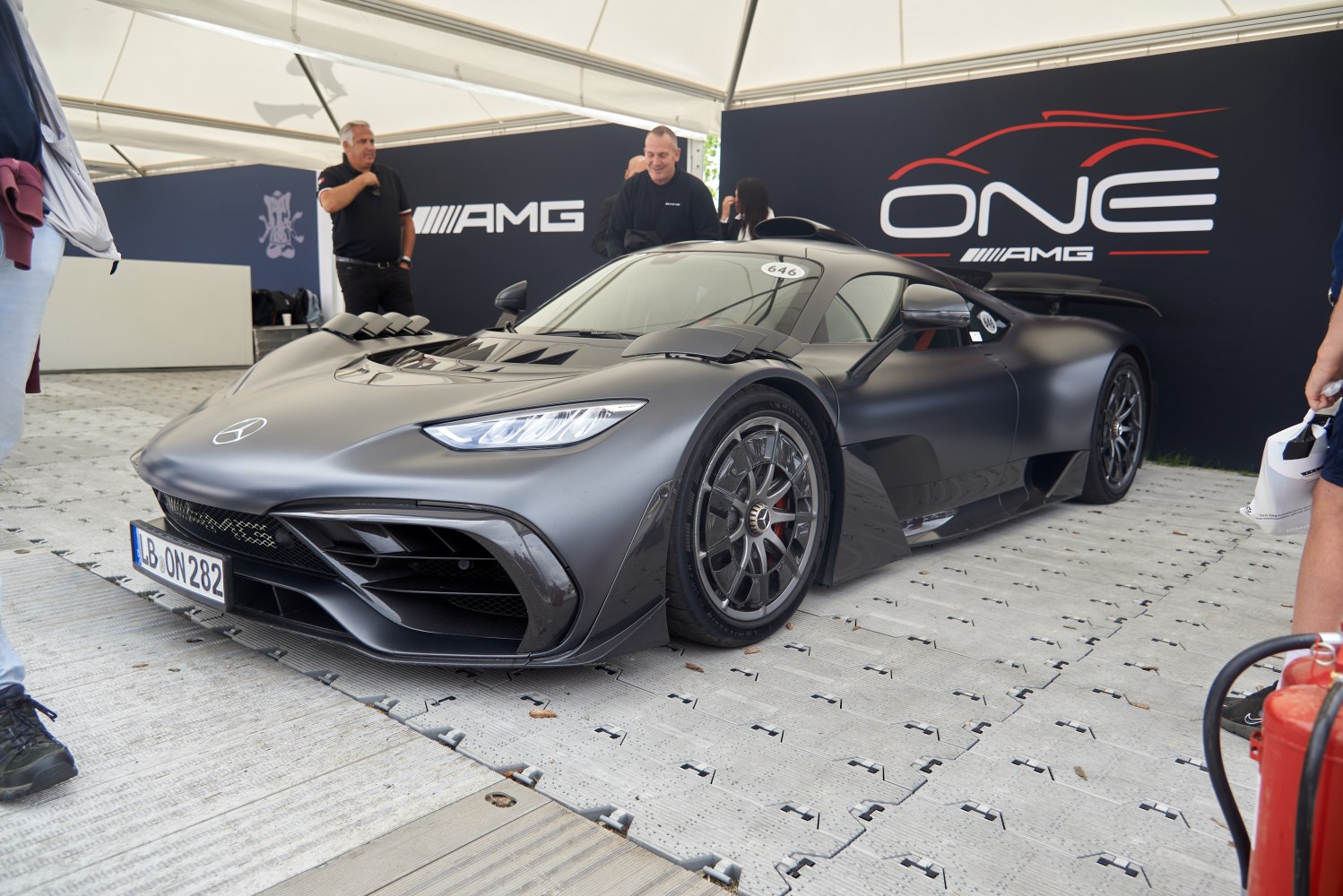 Matte black sports car front with aerodynamic air intakes and detailed wheels