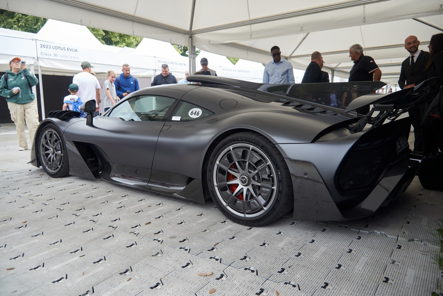 Aerodynamic rear wing and carbon fiber body with sports wheels