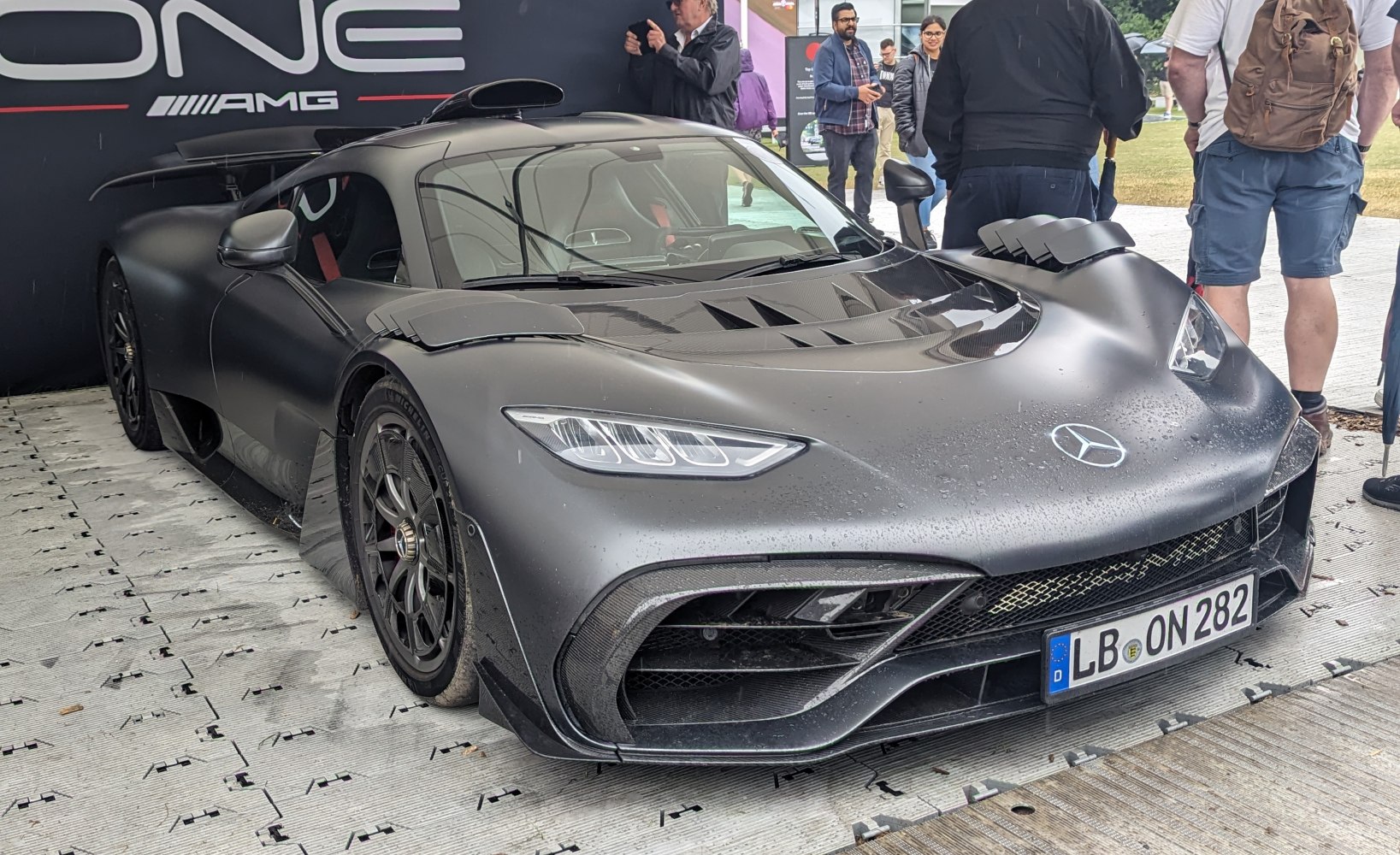 Aerodynamic carbon fiber hypercar front with sharp LED headlights and large intakes