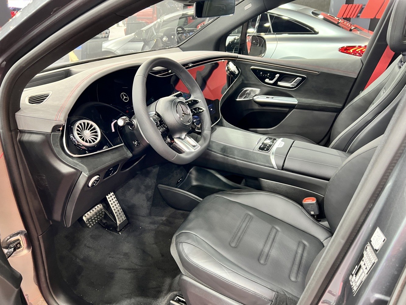 Spacious luxury SUV interior with digital dashboard and premium seating.