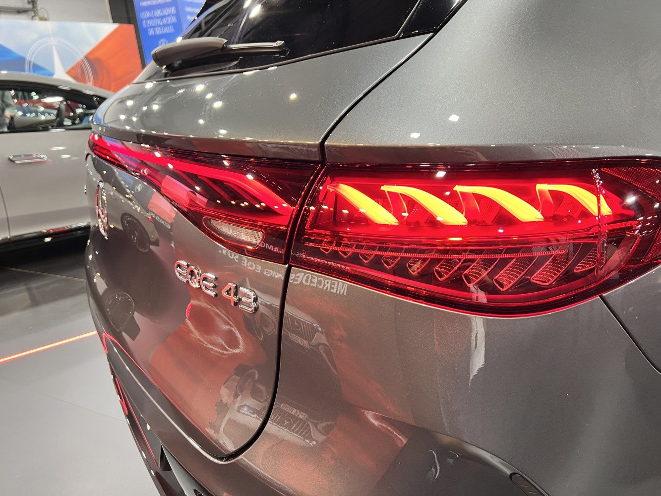 Rear LED tail light and EQE 43 badge on SUV rear