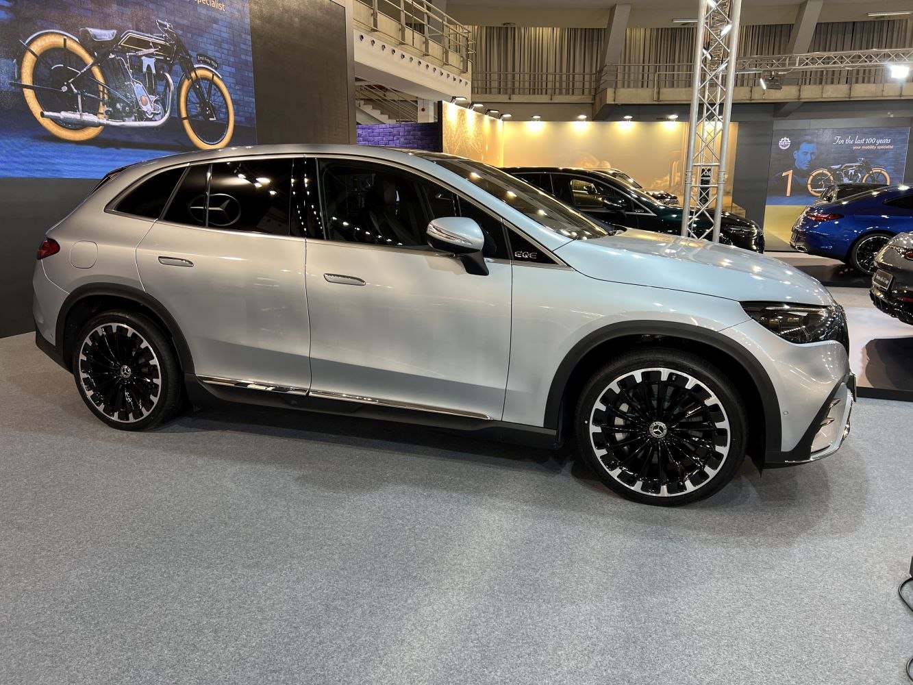 Side profile of an electric SUV with flush door handles and black alloy wheels