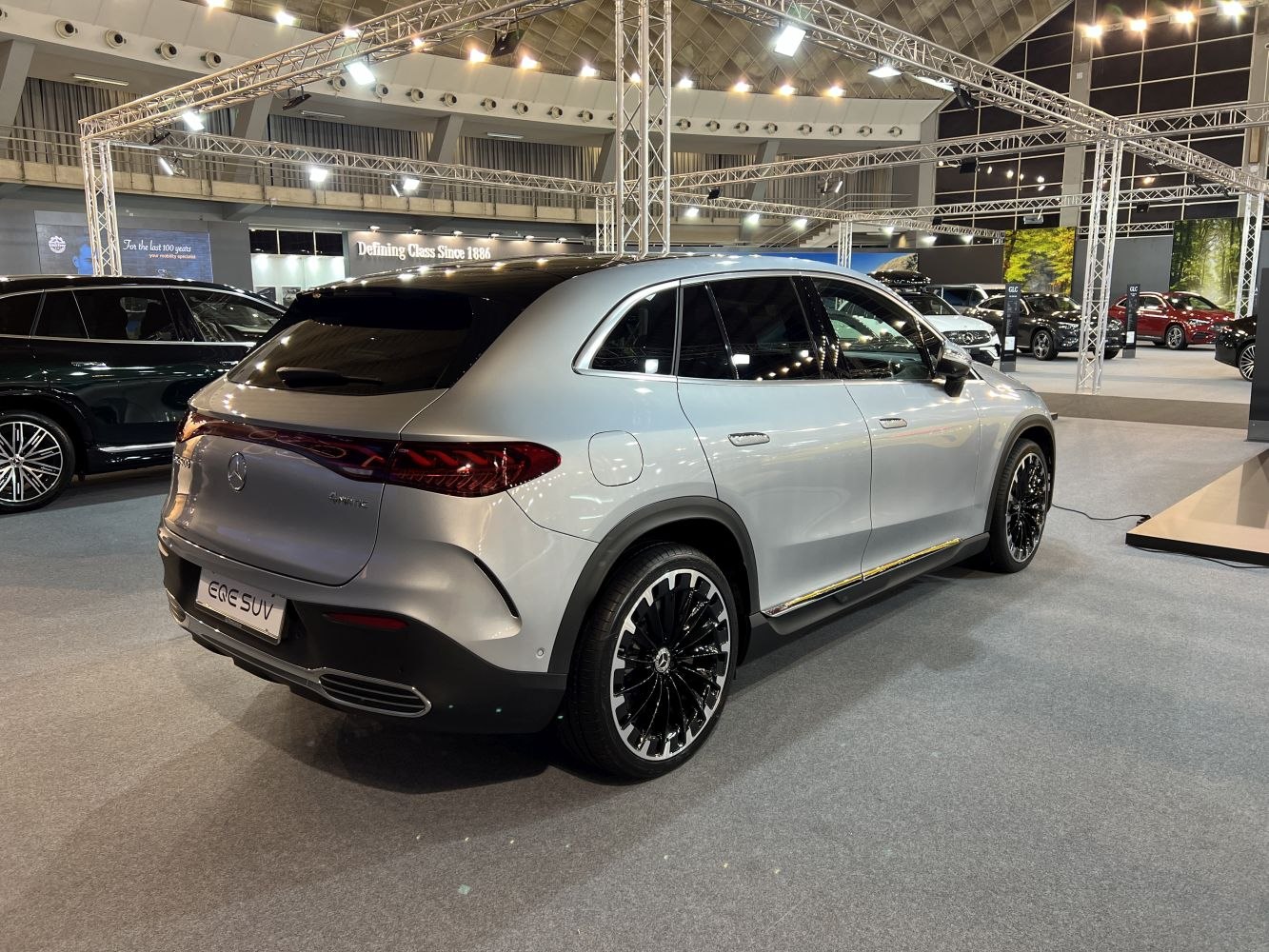 Silver electric SUV rear side with LED taillights and stylish alloy wheels