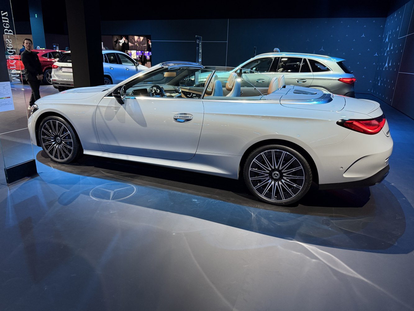 White convertible with distinctive alloy wheels and open-top design
