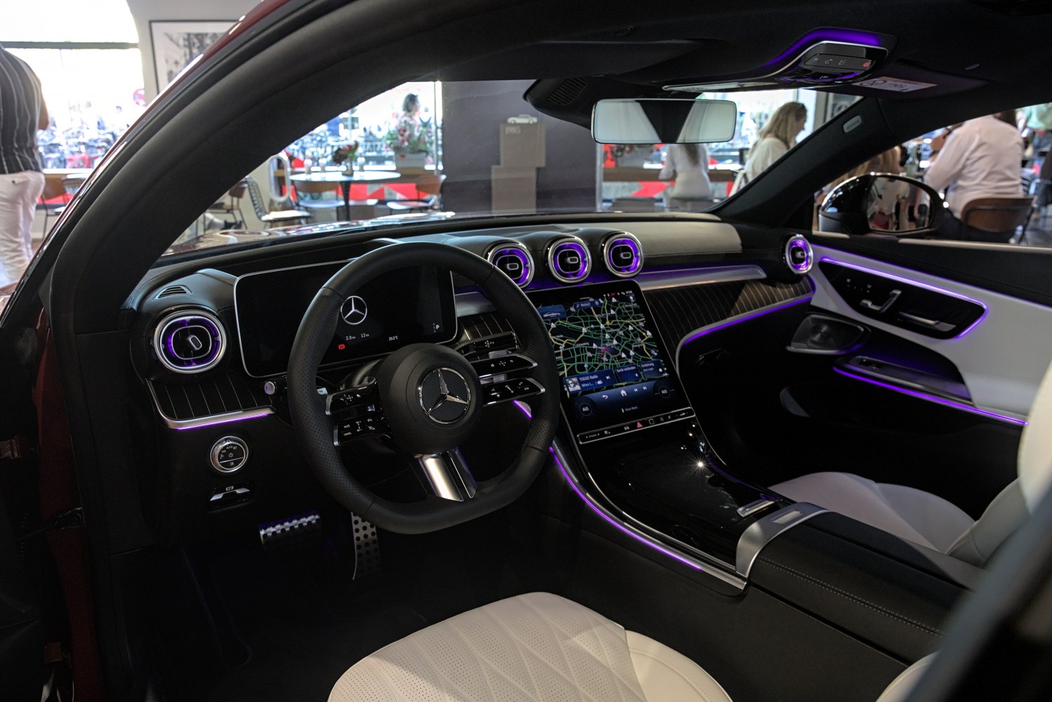 Digital dashboard and ambient lighting inside luxury coupe