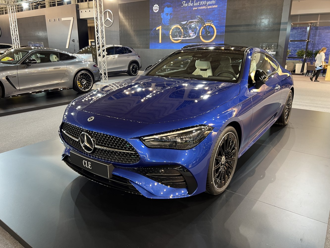 Blue luxury coupe with distinctive grille and sleek LED headlights