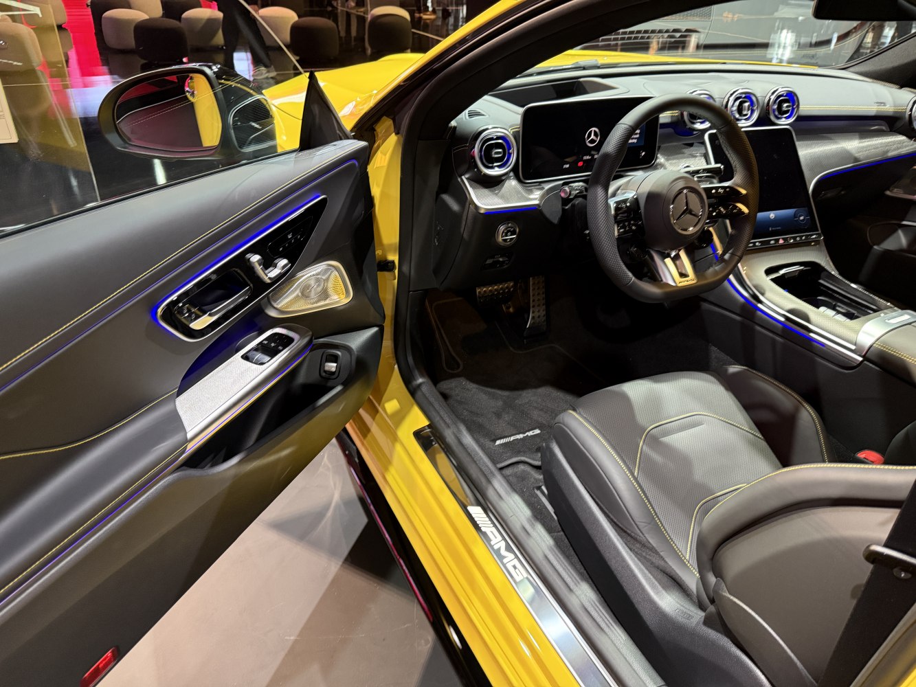 Luxury interior with AMG seats, digital dashboard, and sports steering wheel