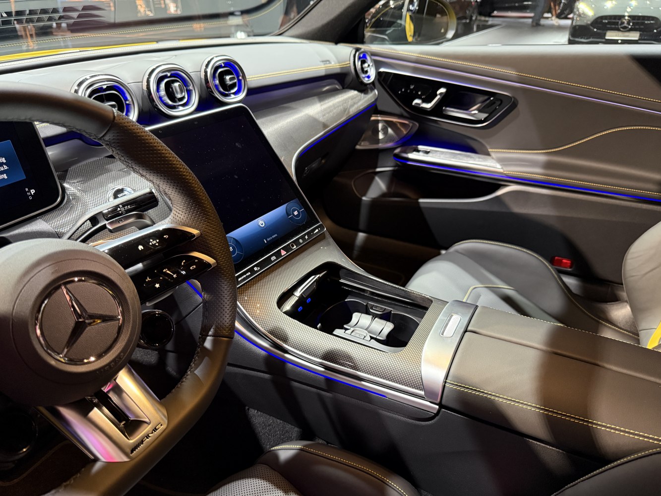 Modern luxury interior with digital touchscreen and ambient blue lighting