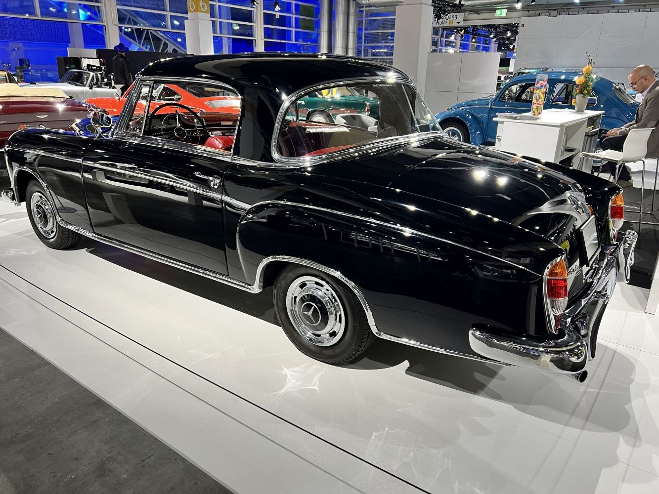 1950s black hardtop coupe with chrome trim and vintage styling