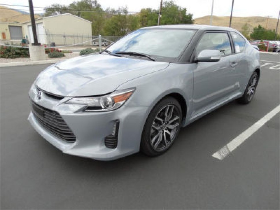Silver sporty coupe with sleek front grille and alloy wheels