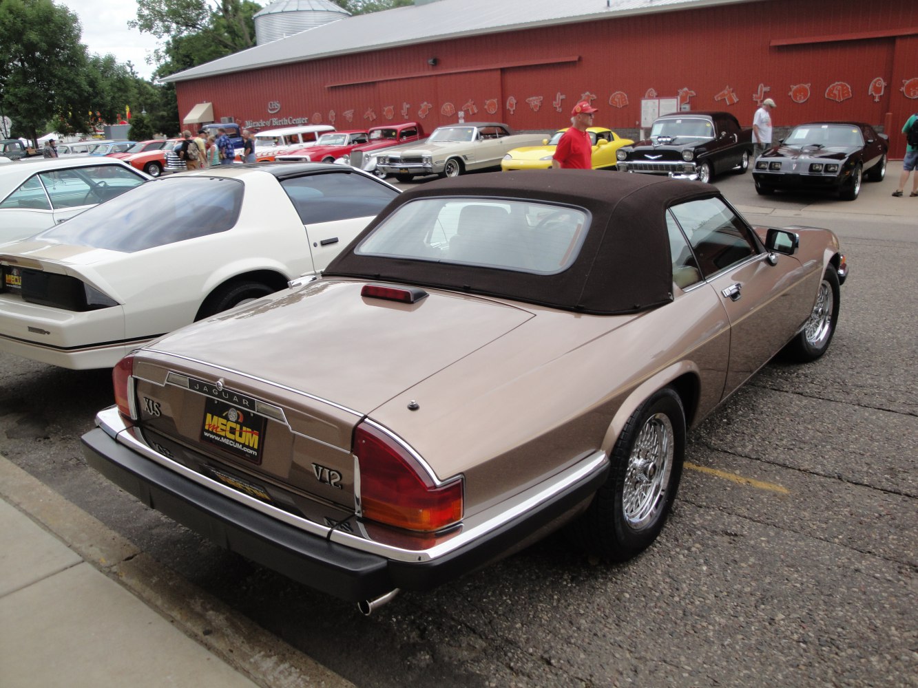 Convertible with soft top and wire-spoke wheels