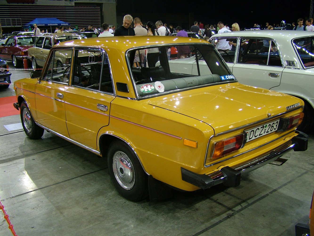 Yellow vintage classic sedan with chrome details and retro design