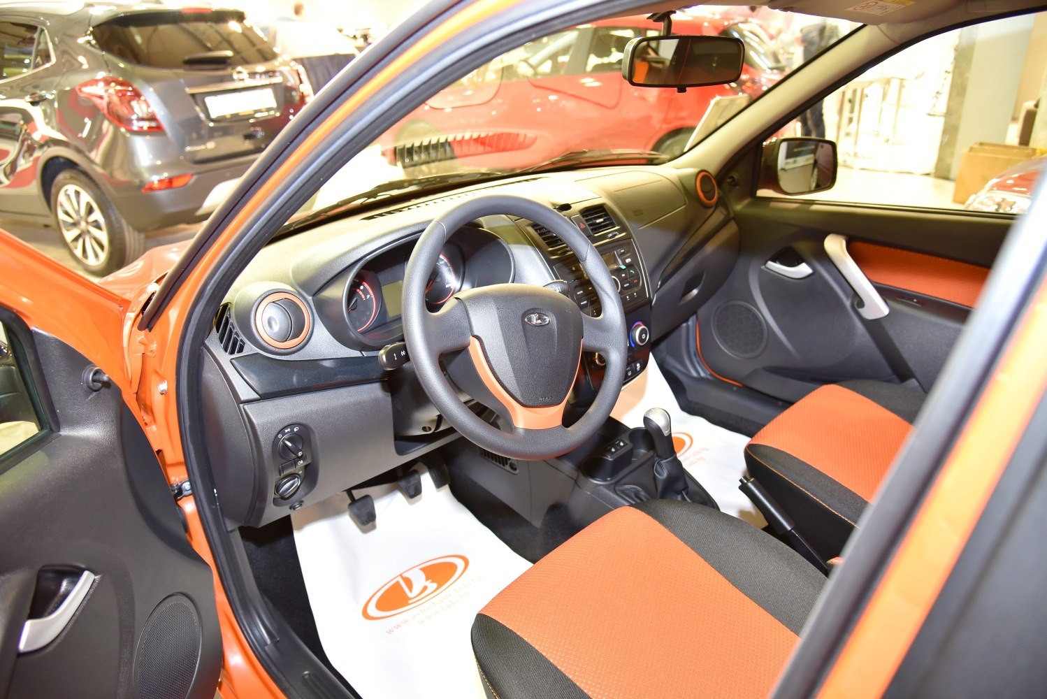 Interior with orange-black seats and orange-accented dashboard