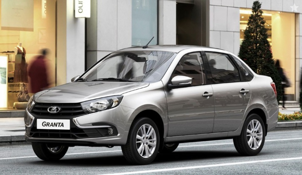 Silver sedan showcasing front and side profiles with updated grille and headlights.