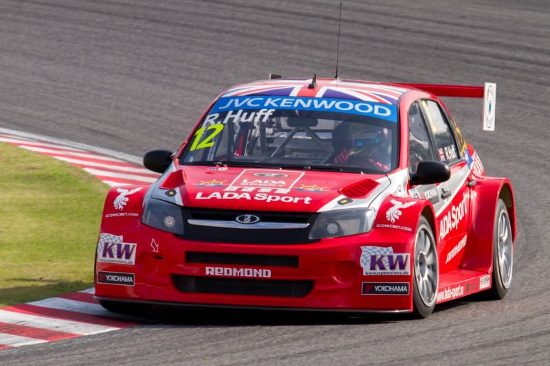 Front view of red Lada Granta I Sport WTCC race car with wide fenders