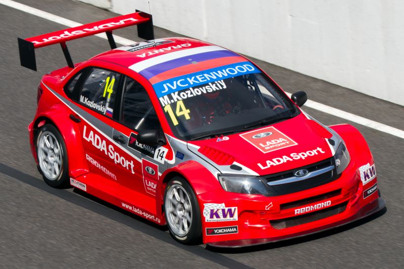 Aerodynamic racing Lada Granta with wide fenders and sponsor decals