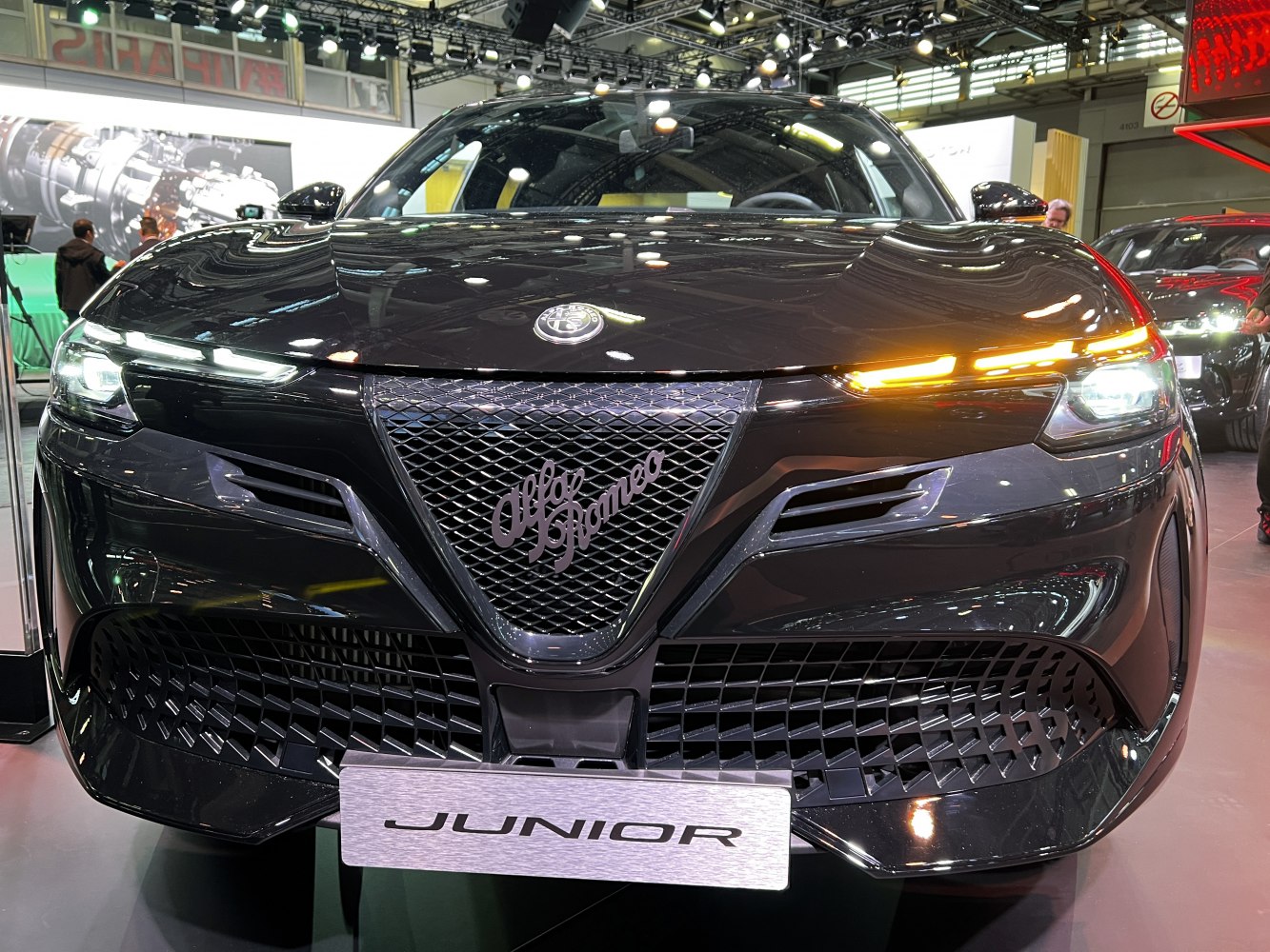 Close-up of front grille and LED headlights with daytime running lights.