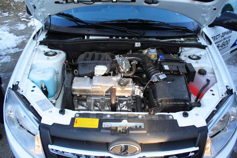 Open engine bay showing detailed engine and components.