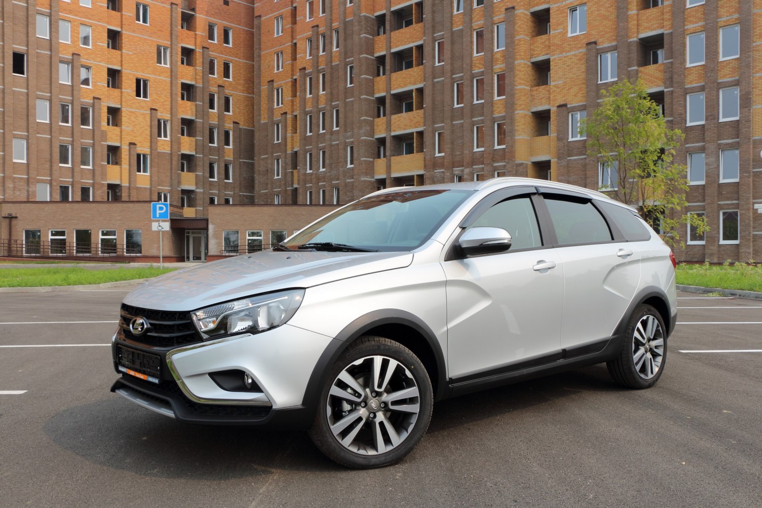 Silver crossover SUV with alloy wheels and front side profile view