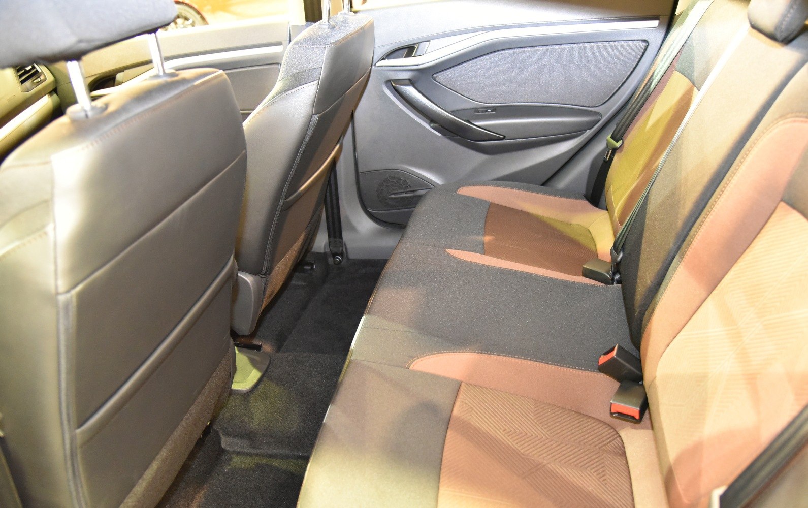 Rear passenger seating with upholstery and door panel details