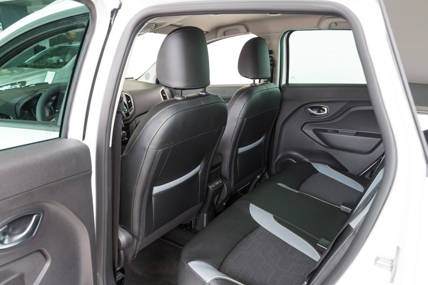 Rear seats and door panel with black and gray upholstery