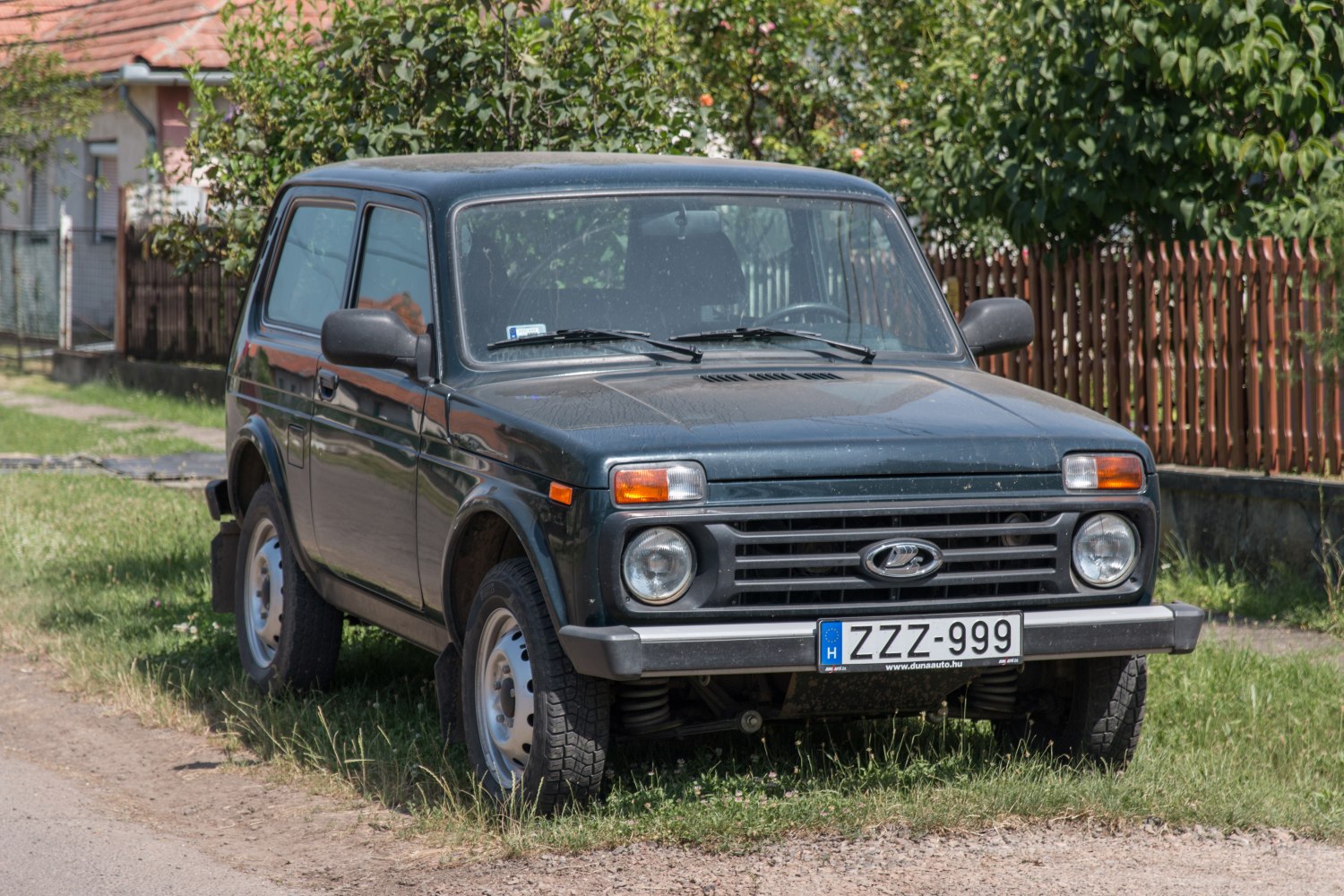 Black 3-door off-road SUV with retro styling and round headlights