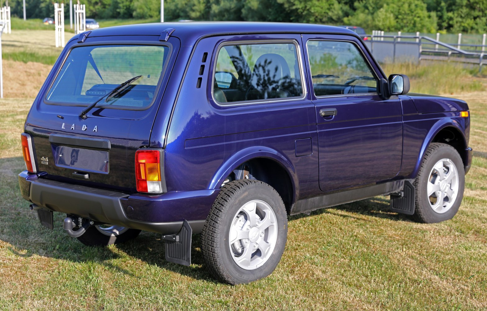 Rear-side view of a compact 3-door SUV with off-road features