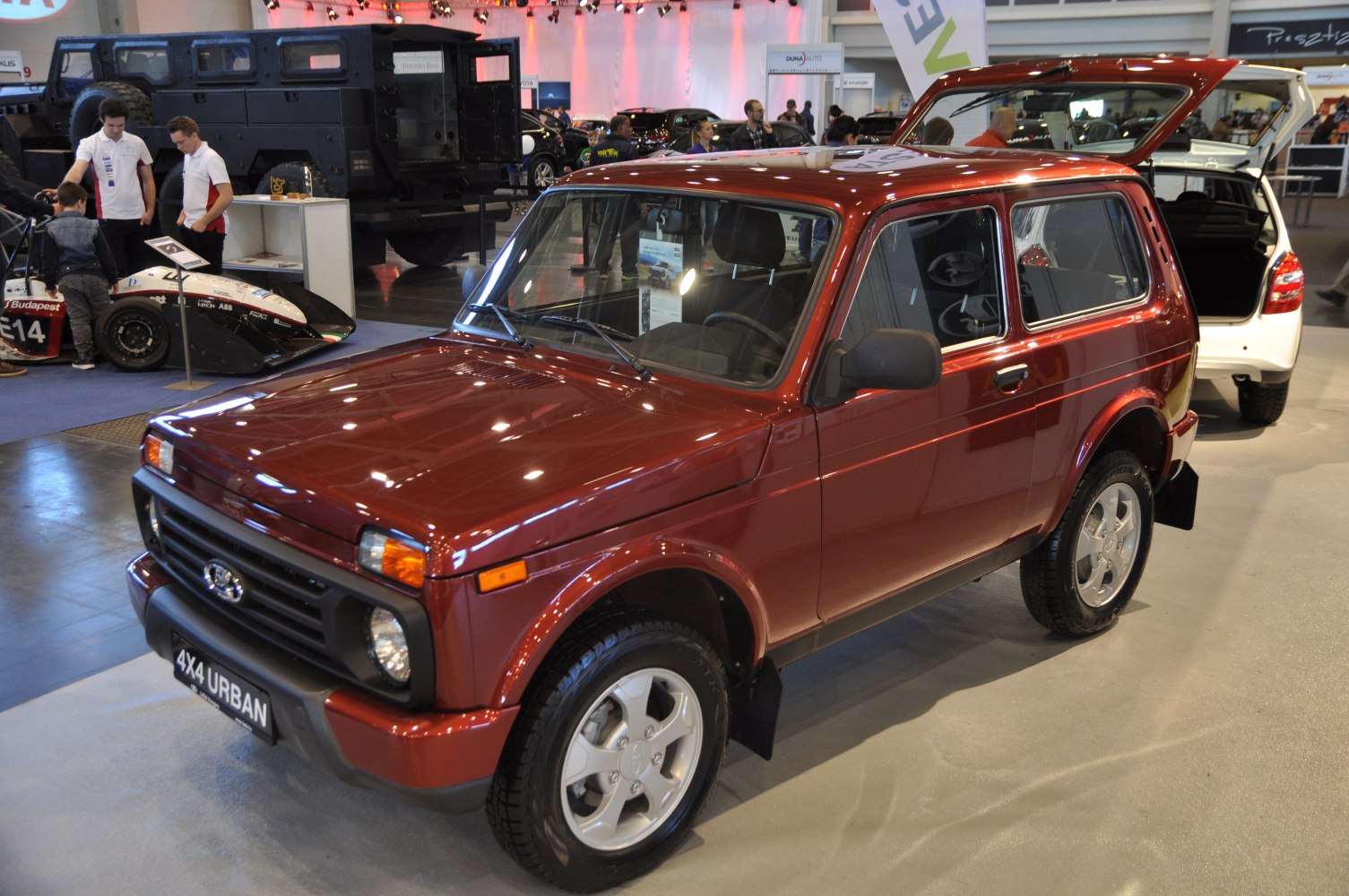 Compact 3-door dark red SUV with 4x4 and off-road capabilities
