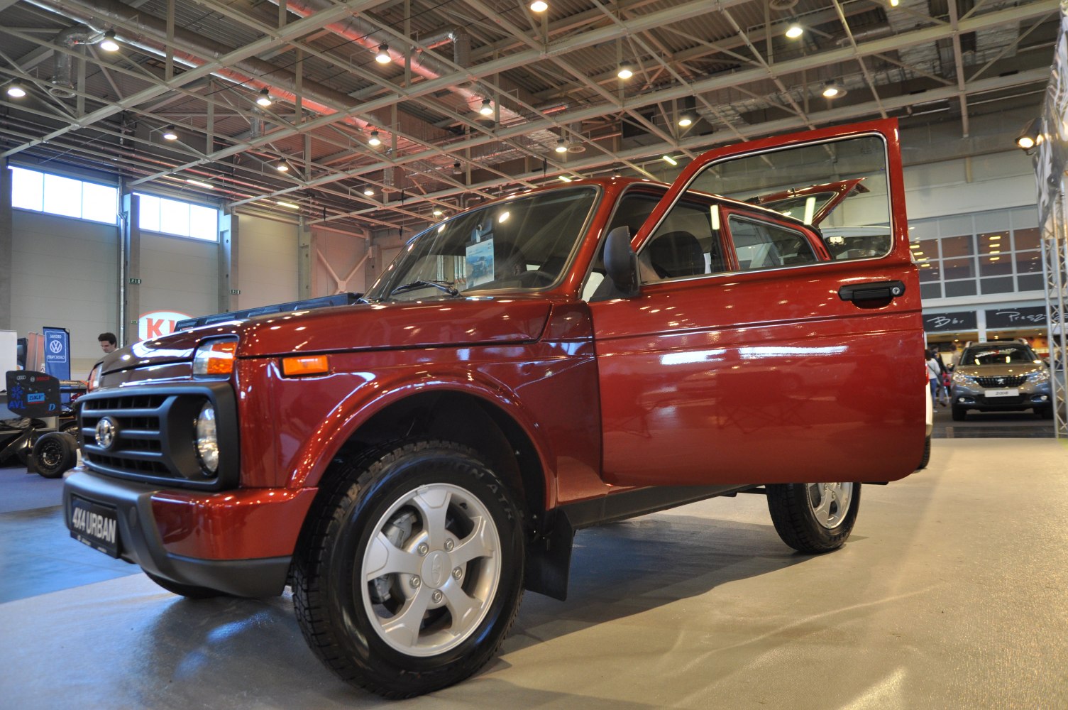 Red SUV front view with open door