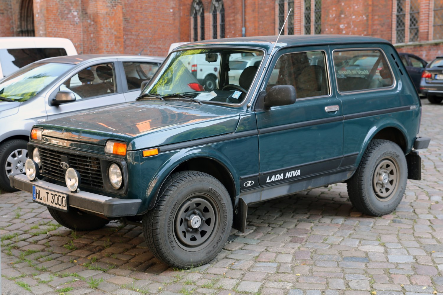3-door SUV with round headlights and off-road tires
