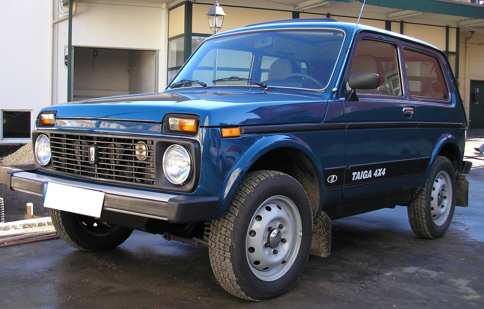 3-door SUV with Taiga 4x4 decal, round headlights, and metal wheels