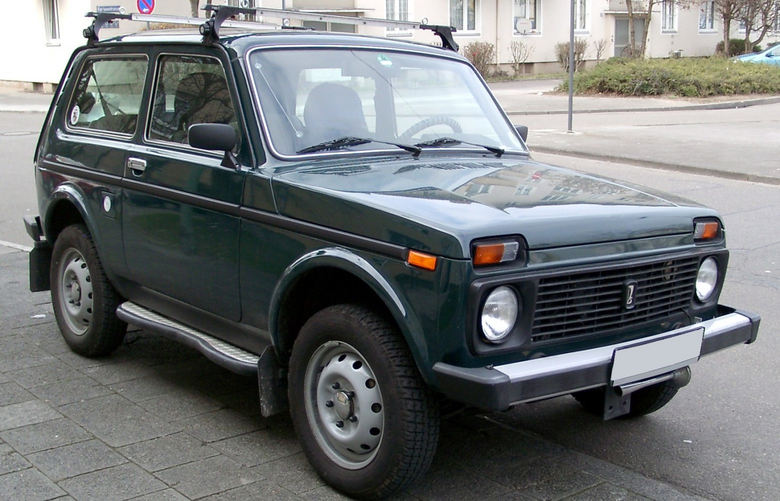 Compact 3-door vehicle with rugged design and classic front grille