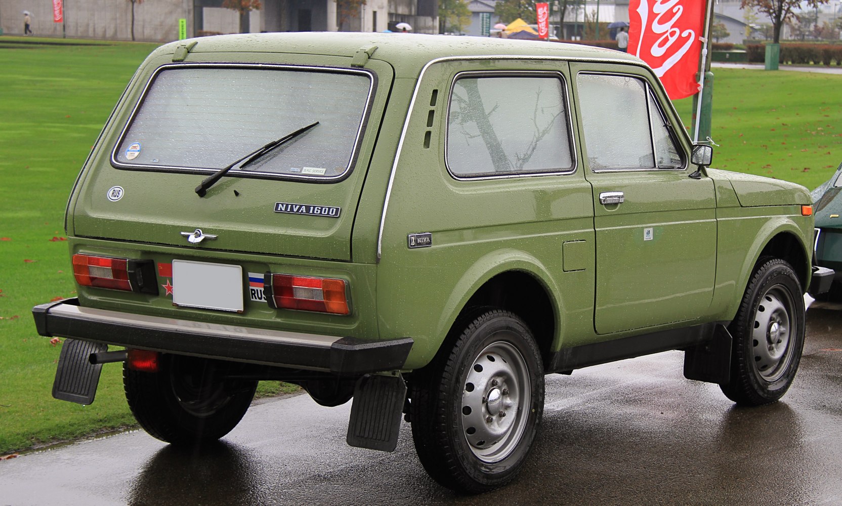 Rear and side view of a 3-door SUV with distinctive rear window wiper and classic styling.
