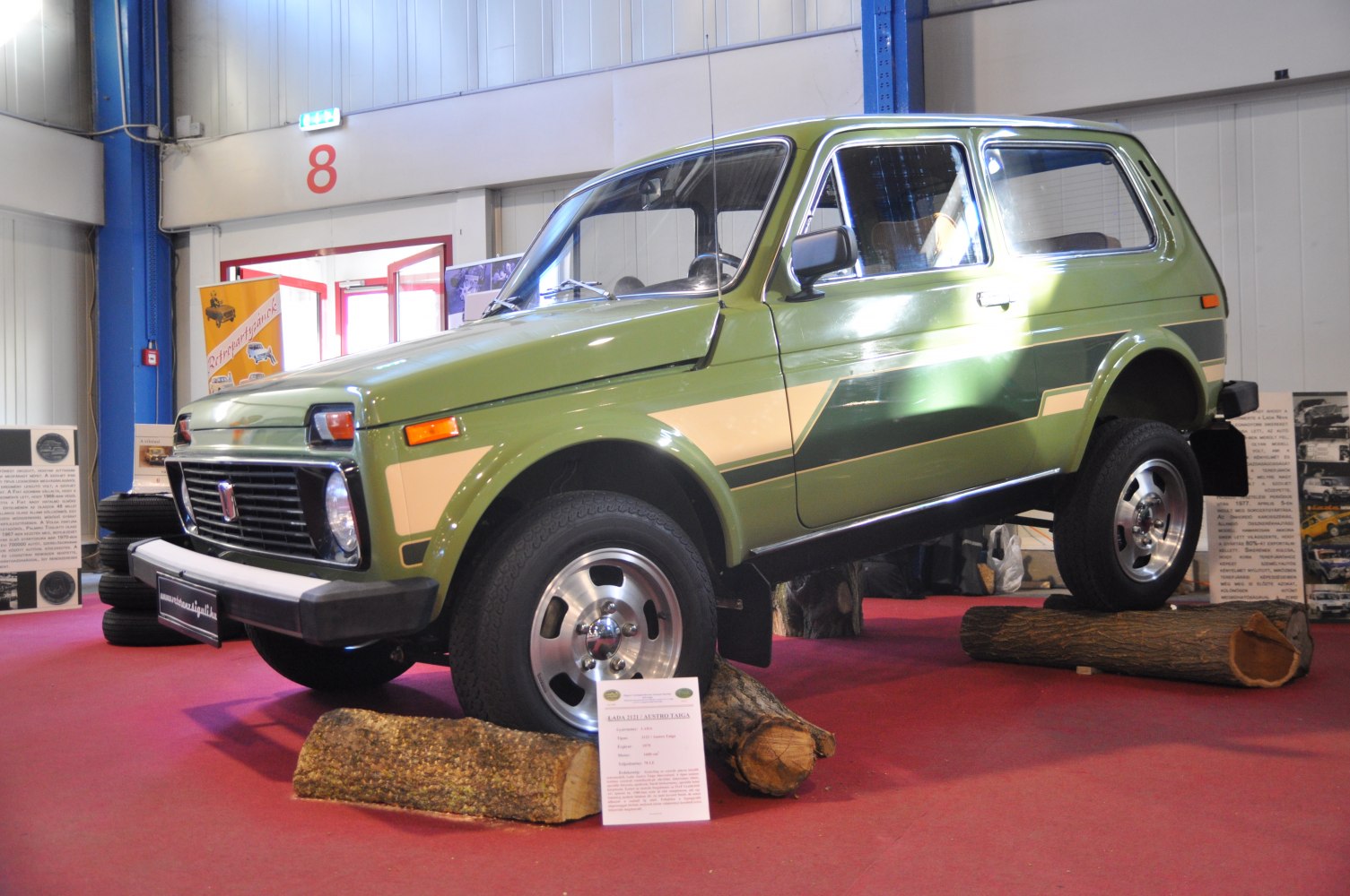 Off-road SUV with elevated suspension and painted side stripe
