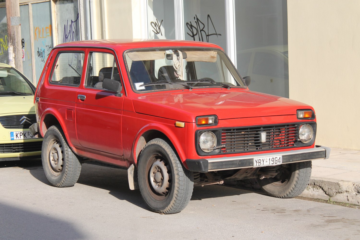 3-door boxy SUV with square headlights and steel wheels