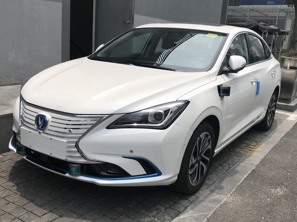Front and side view of sedan with modern headlights and aerodynamic shape