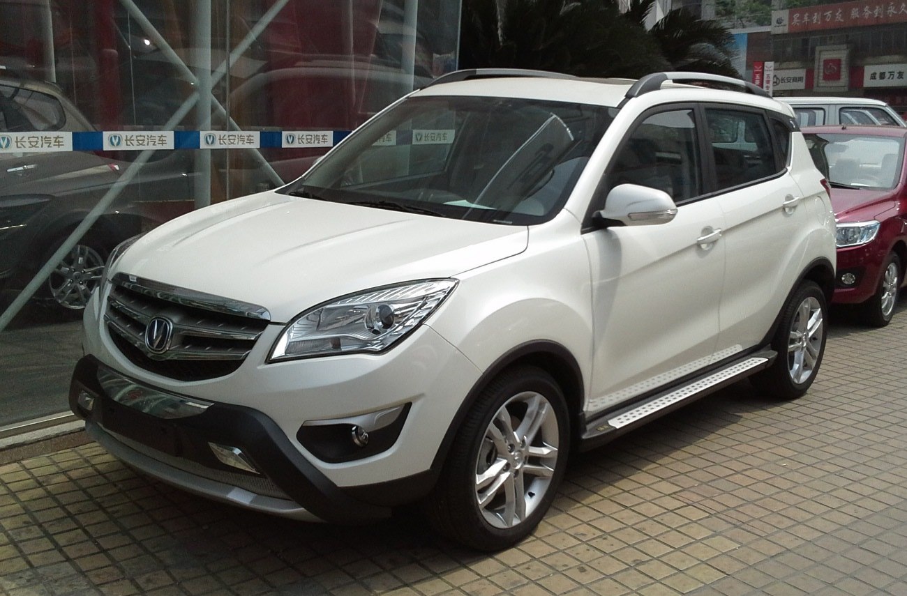 White compact SUV with roof rails and alloy wheels